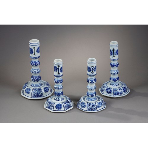 Very rare suite of four candle holders in blue white porcelain of European shape